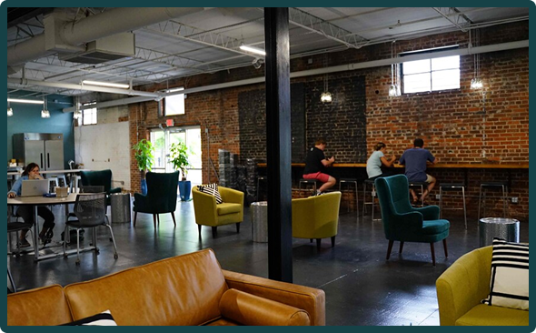 Krumware's modern office space in Columbia with brick walls and comfortable seating
